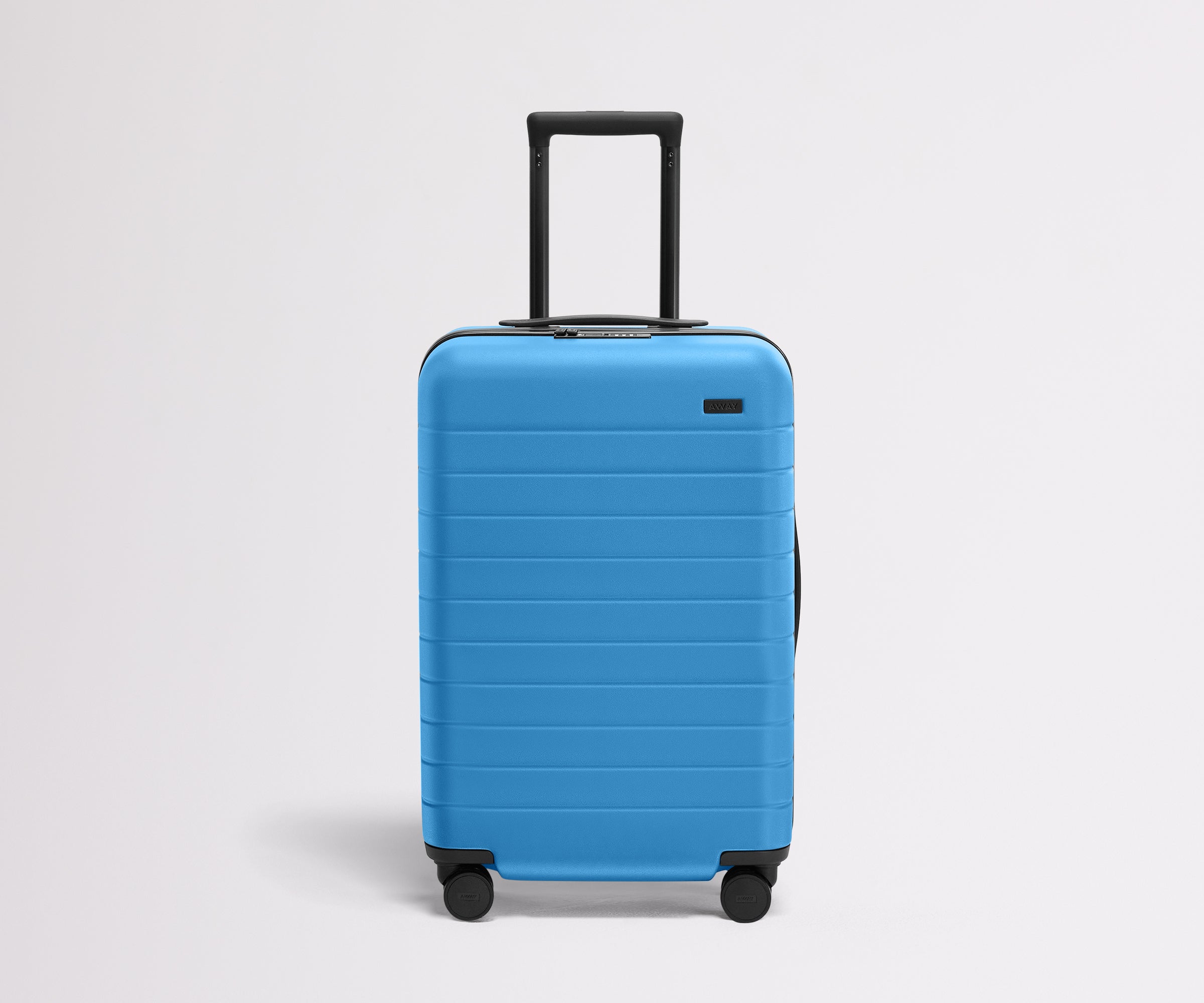 Front product view of The Bigger Carry-On Flex suitcase in Splash Blue with raised handle