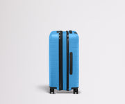 Side product view of The Bigger Carry-On Flex suitcase in Splash Blue shown fully expanded