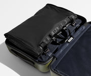 Folded Garment Sleeve packed and clipped inside The Bigger Carry-On