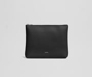 Black pouch with 'AWAY' branding on a light gray background