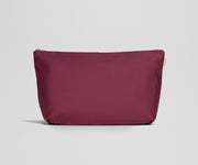 Maroon pouch with a zipper on a light gray background