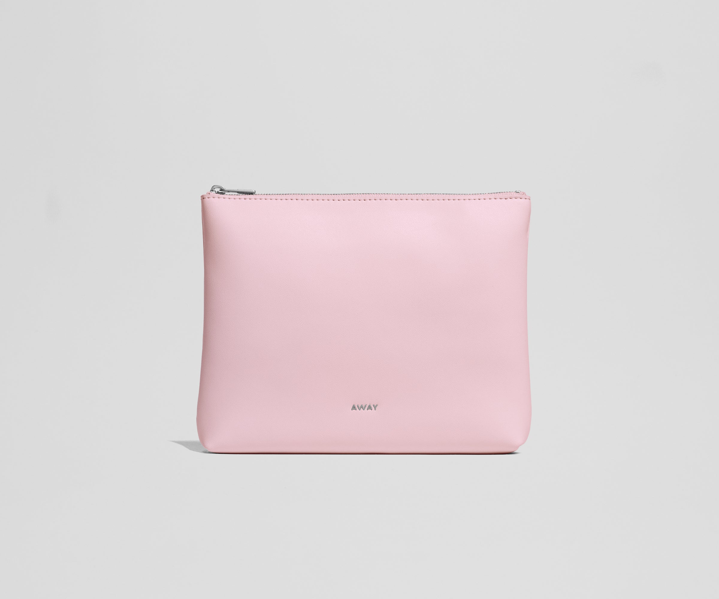 Pink pouch with an AWAY logo on a light gray background