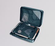 Open teal travel case with mesh interior on a light gray background