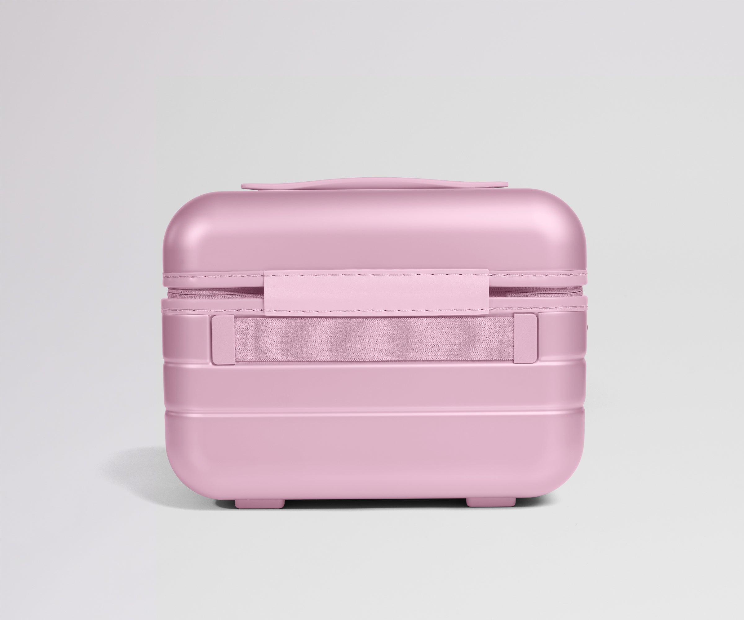 Pink travel case on a light gray background