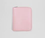 Pink wallet with a brand logo on a light gray background