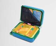 The Kids Carry-On suitcase in Splash Blue shown open on its side and packed with Away's packing organizers to show capacity and the interior compression system, designed to help you pack more in