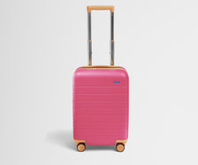 Front product view of The Kids Carry-On suitcase in Cotton Candy Pink with raised handle