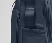 Close up view of the hidden zipper pocket, water bottle pocket, and side webbing loops