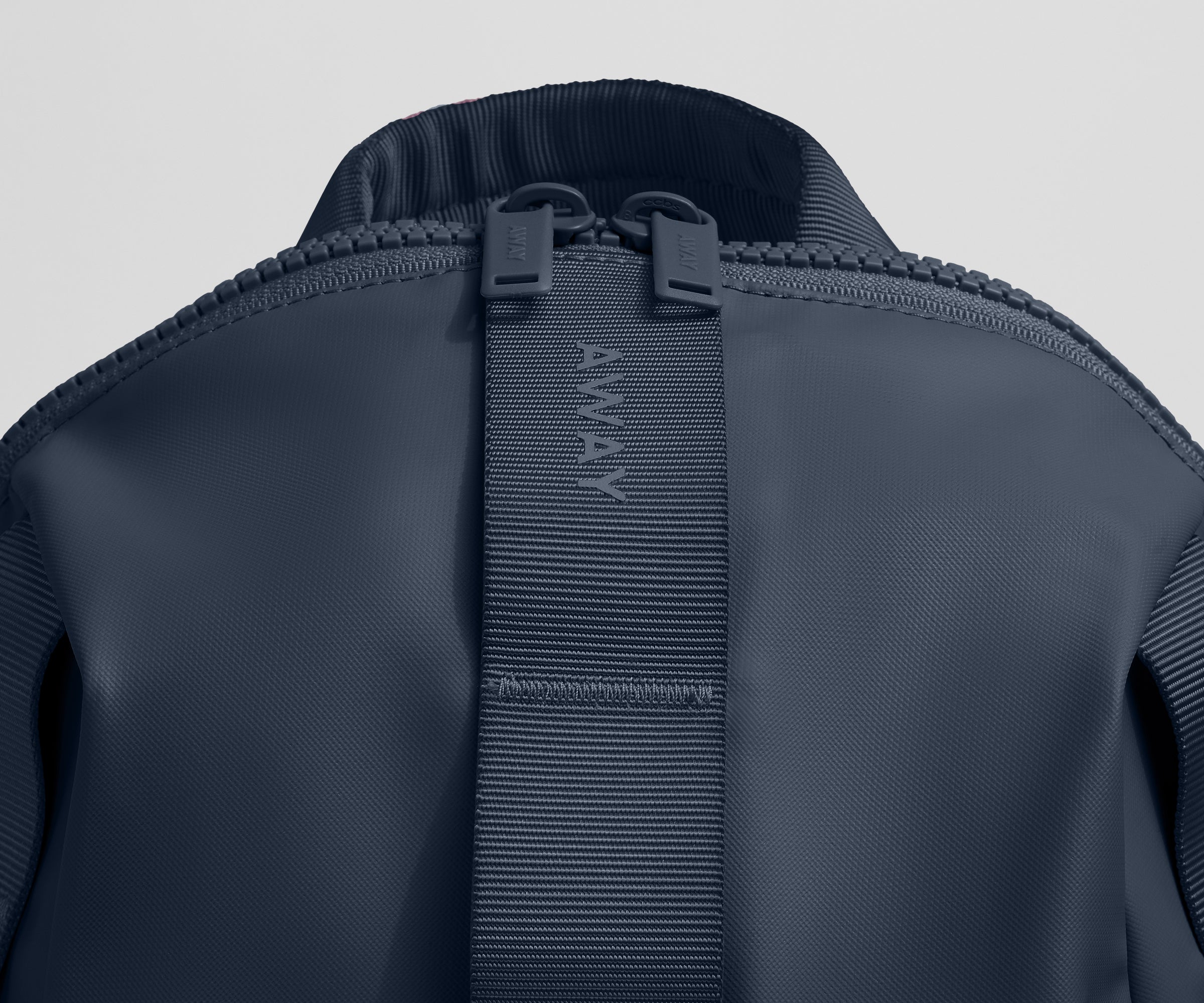 Close up view of the material and Away logo