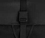 Detailed view of the fabric and buckle strap closure