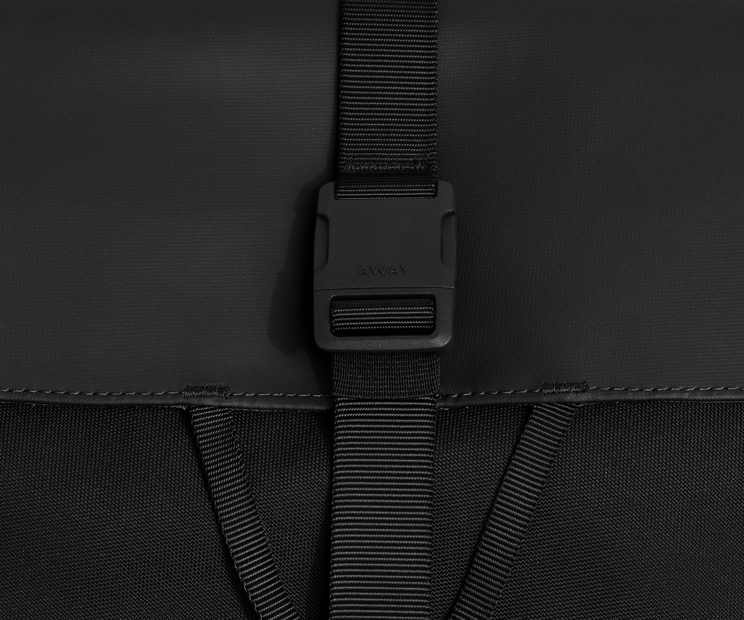 Detailed view of the fabric and buckle strap closure