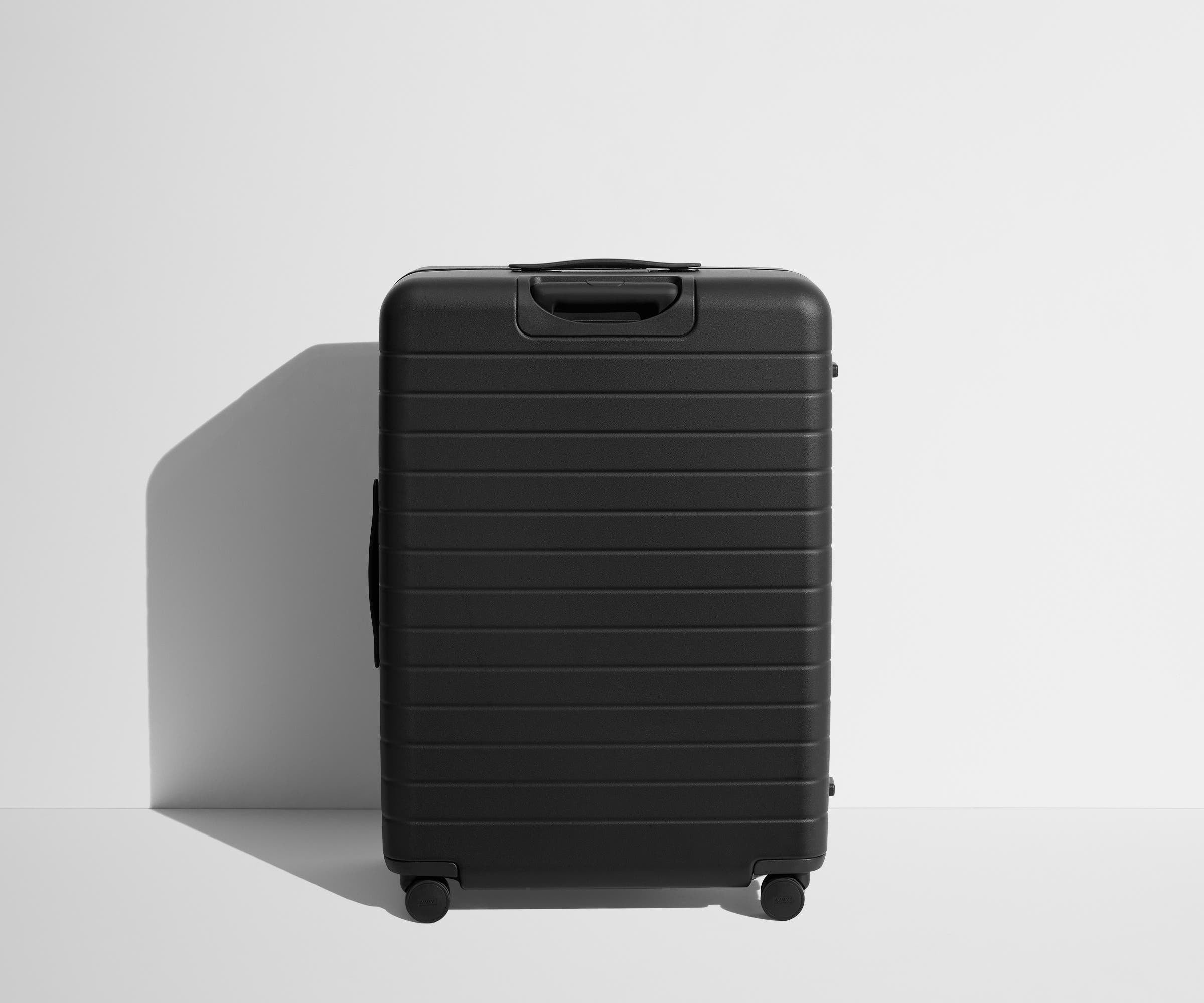 Back product view of The Large Flex suitcase in Jet Black
