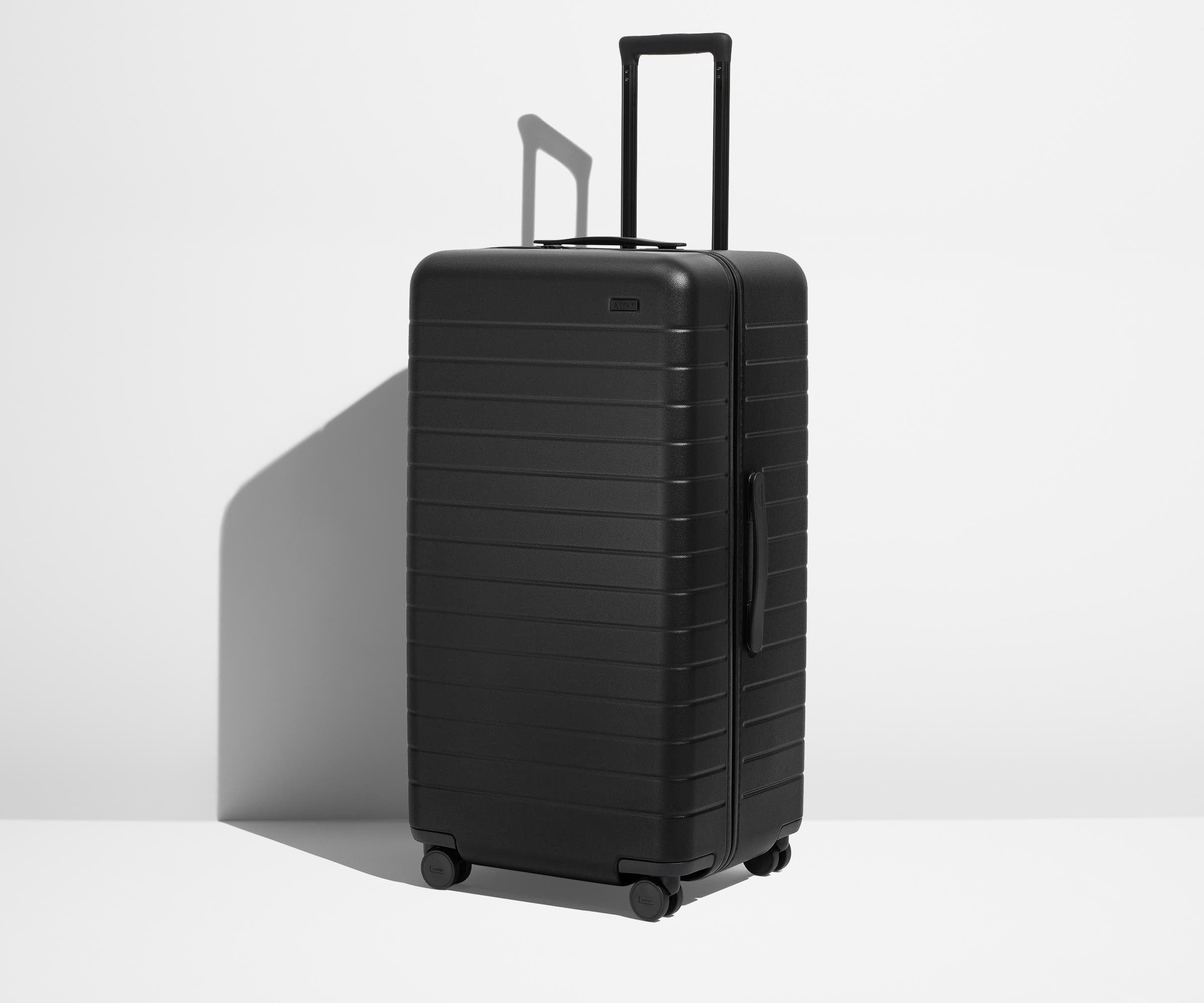 Angled product view of The Trunk suitcase in Jet Black