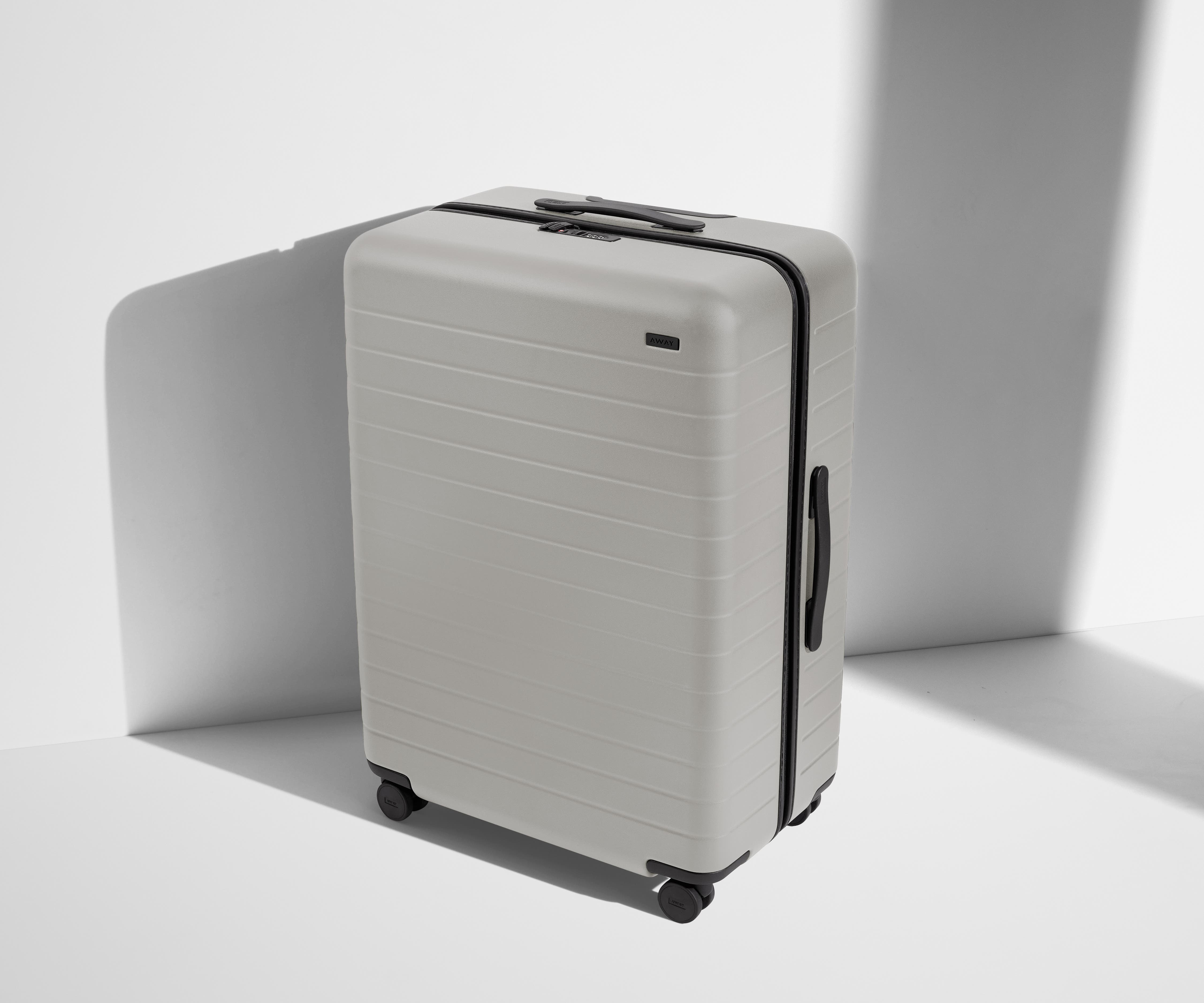 Angled product view of The Large suitcase in Cloud Gray