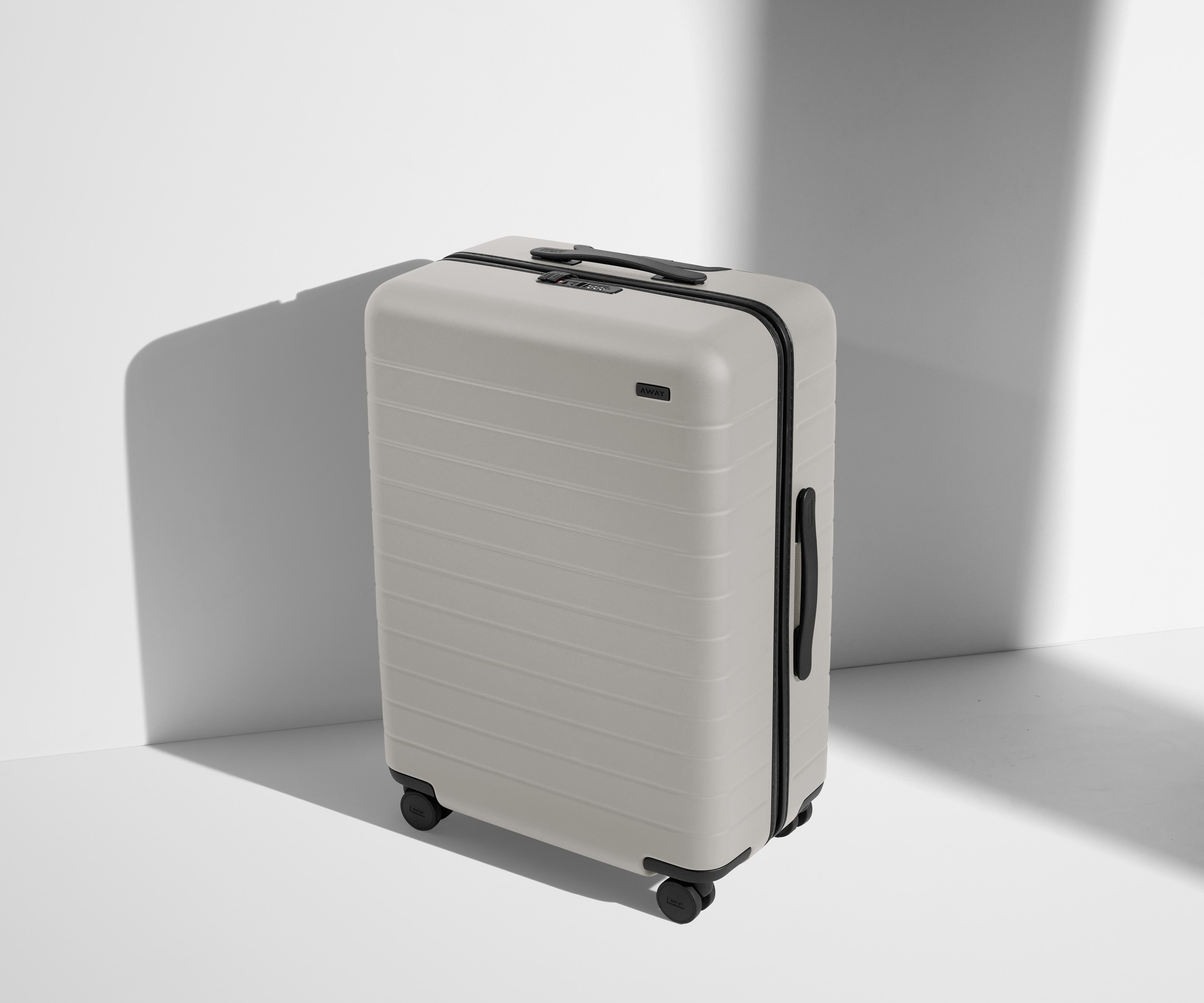 Angled product view of The Medium suitcase in Cloud Gray