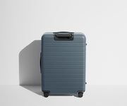 Back product view of The Medium Flex suitcase in Coast Blue