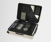 Open suitcase with organized compartments on a light gray background