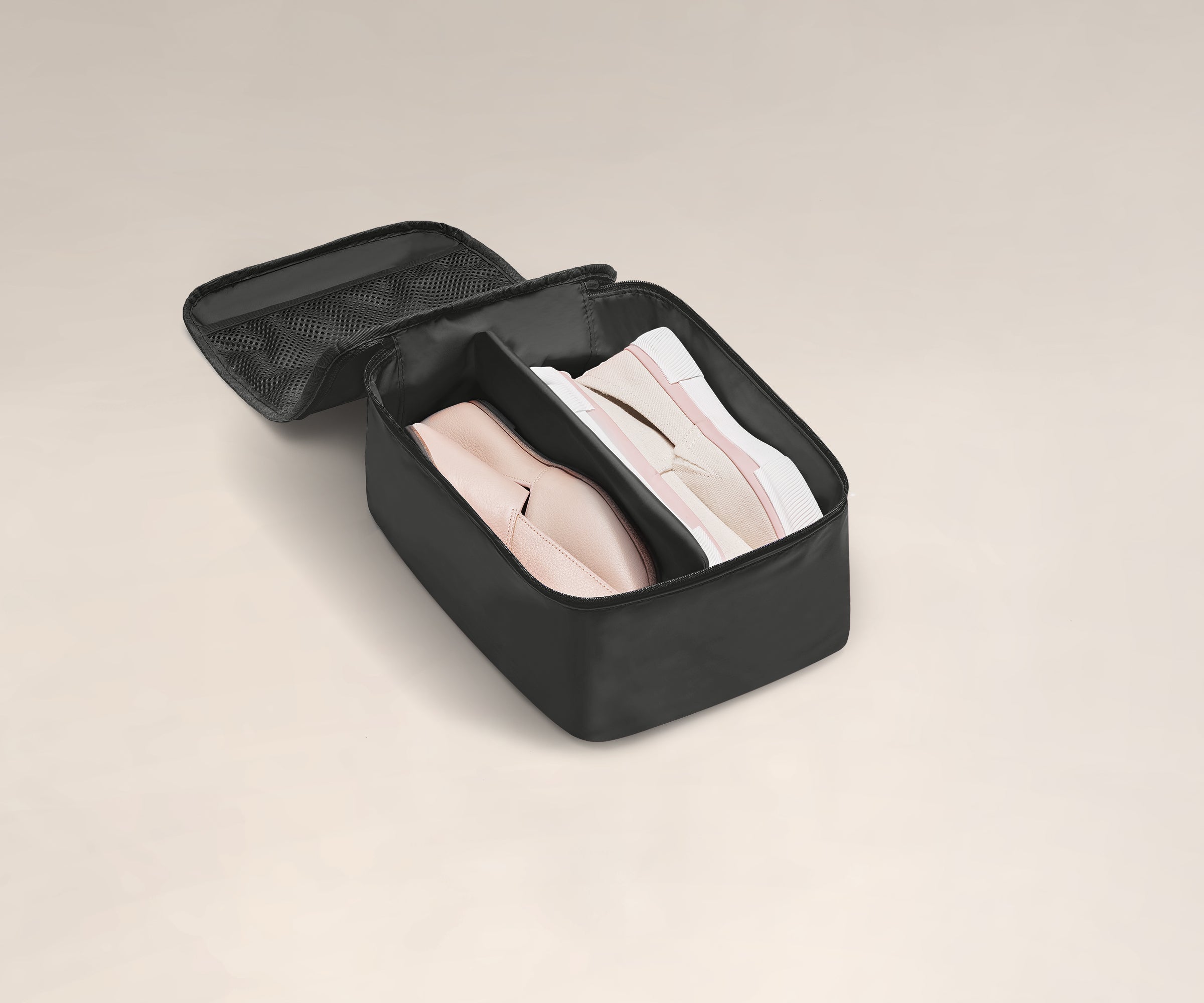 Two pairs of shoes in a small Shoe Cube