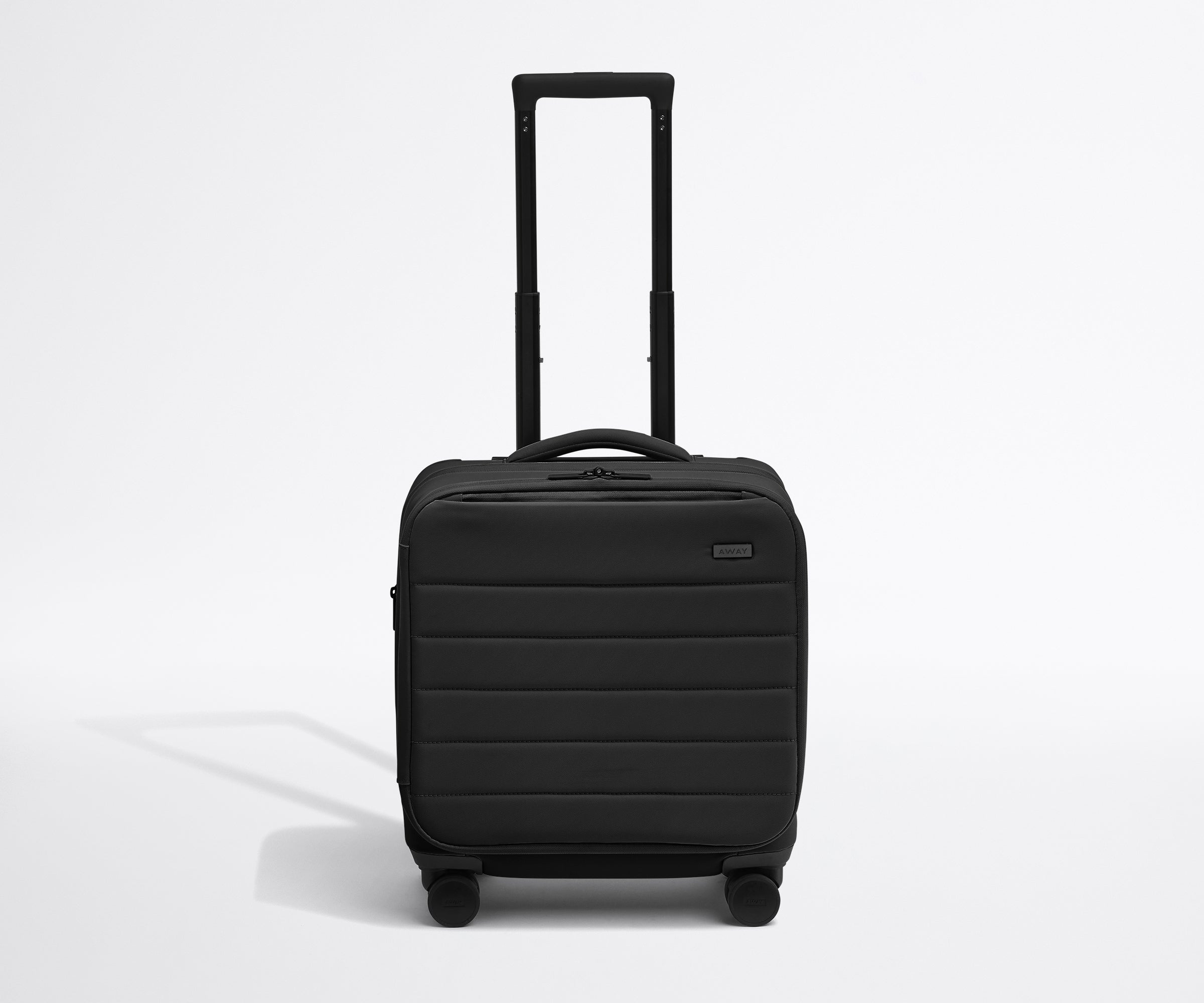 Front product view of The Softside Compact Carry-On suitcase in Jet Black with raised handle