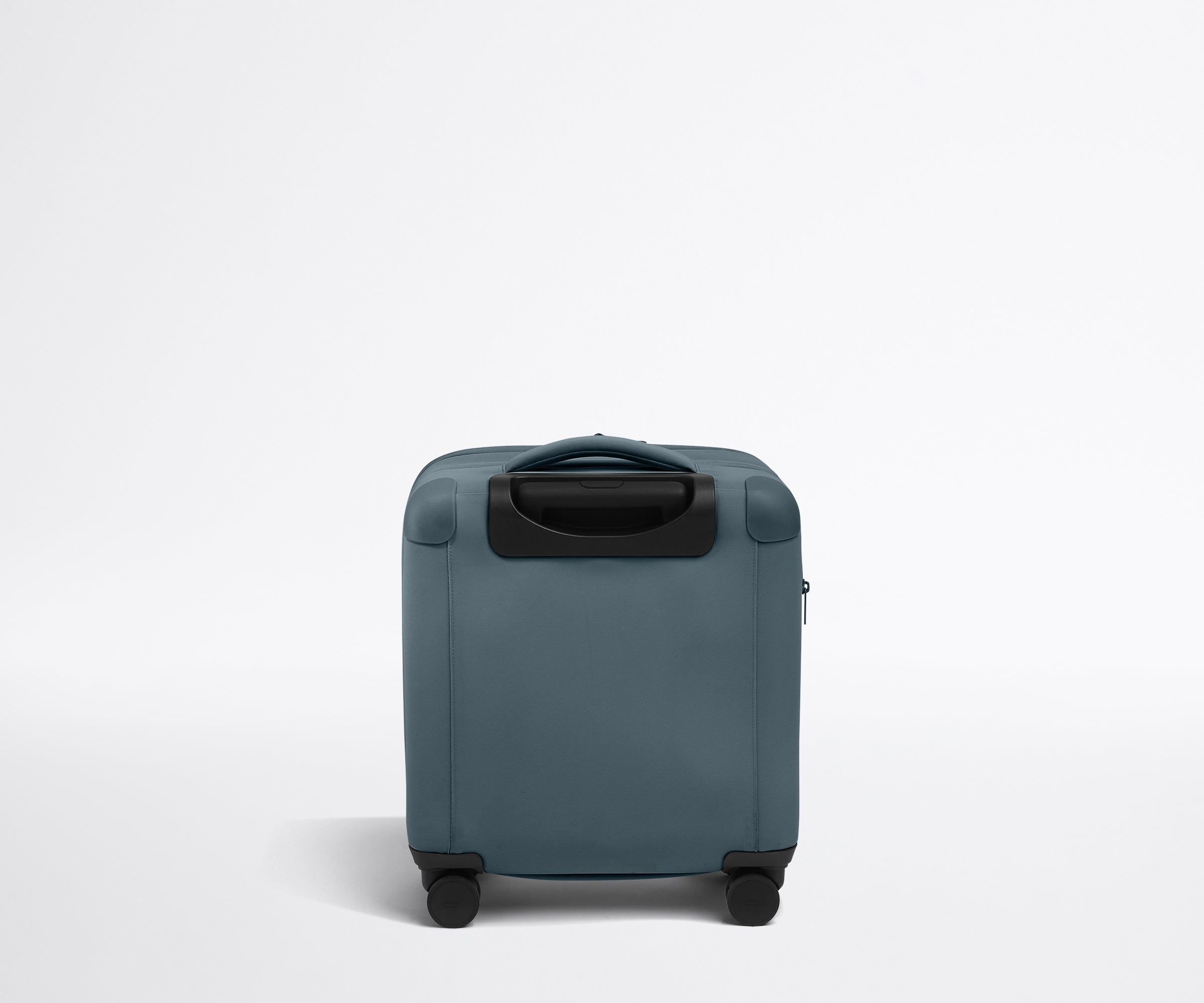Back product view of The Softside Compact Carry-On suitcase in Coast Blue