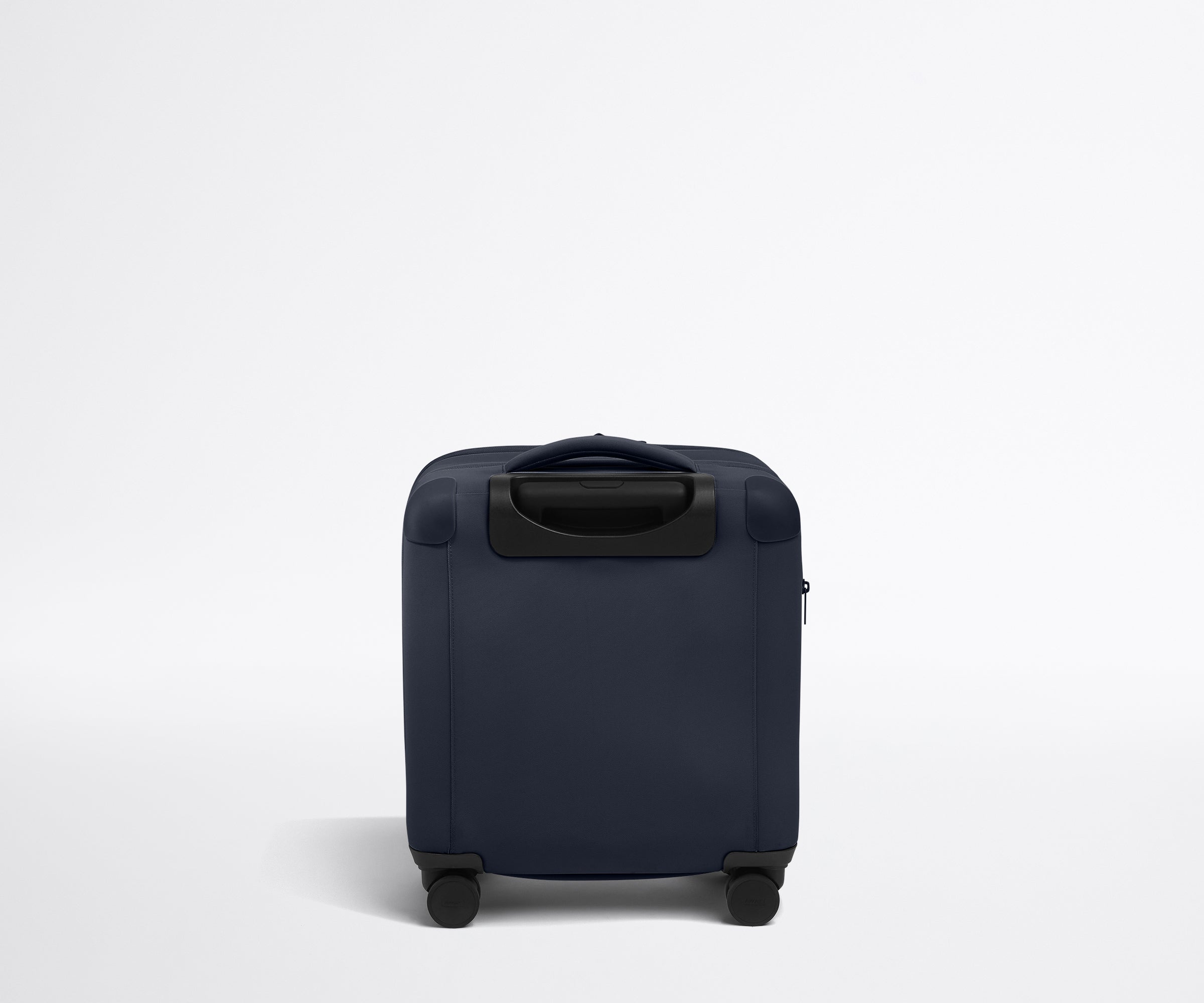 Back product view of The Softside Compact Carry-On suitcase in Navy Blue