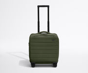Front product view of The Softside Compact Carry-On suitcase in Olive Green with raised handle