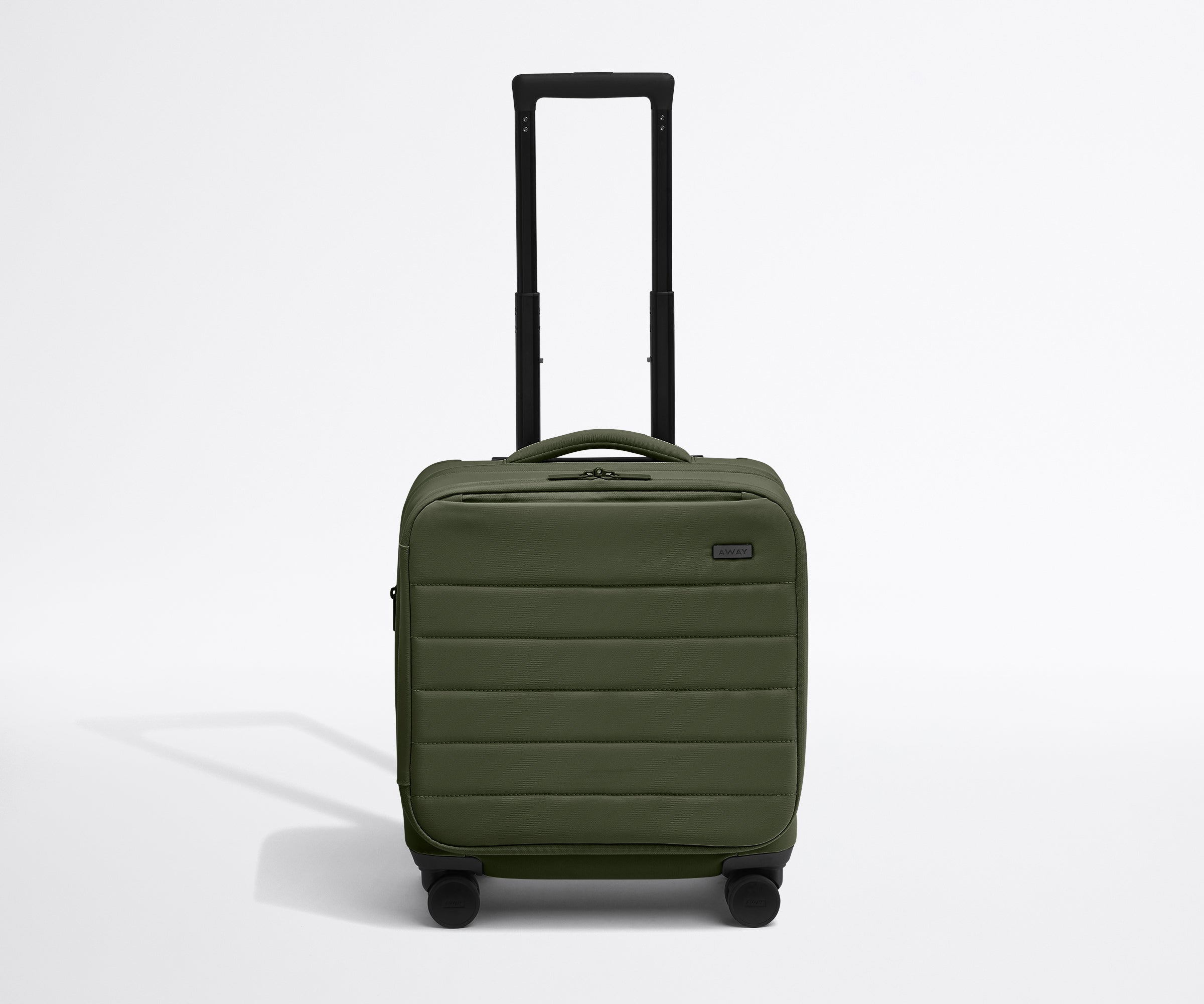 Front product view of The Softside Compact Carry-On suitcase in Olive Green with raised handle