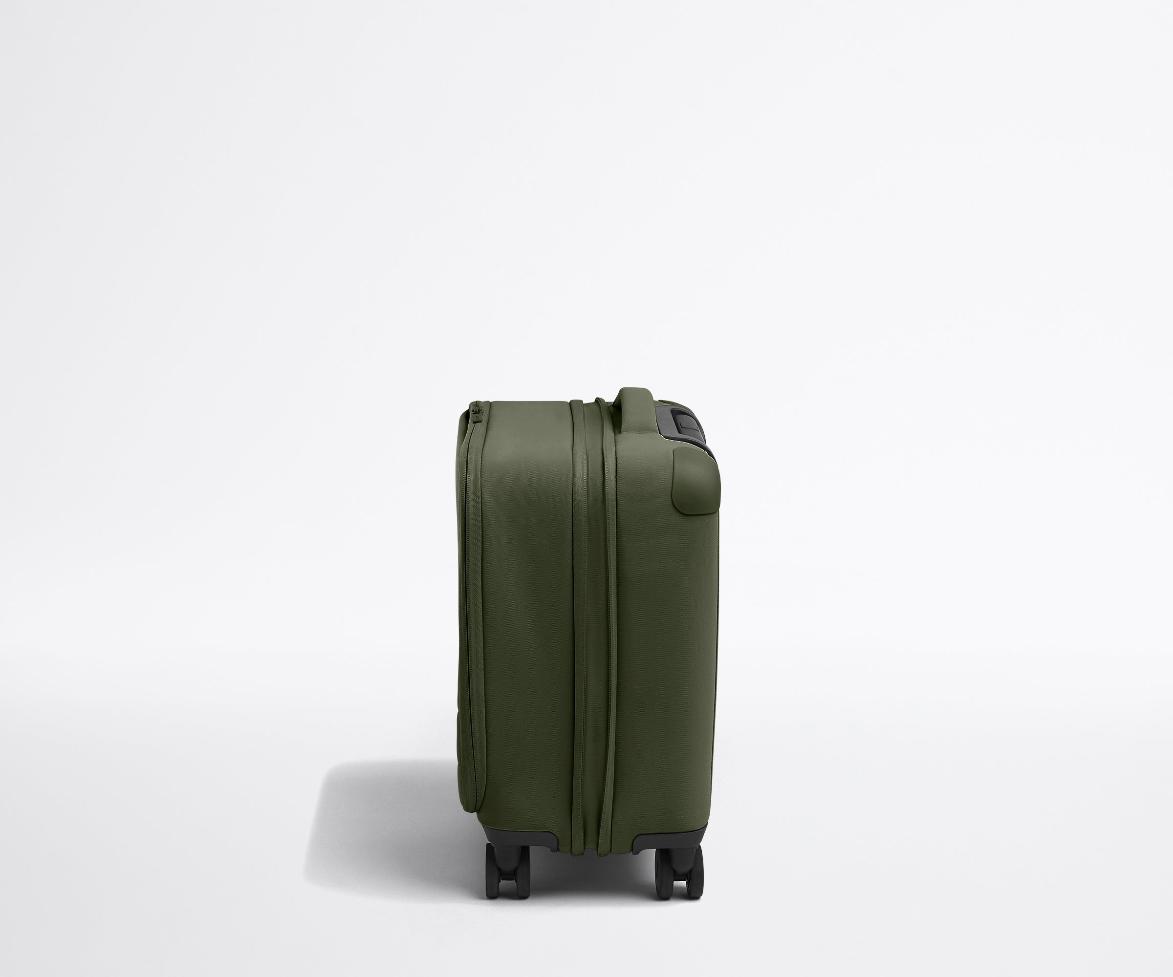 Side product view of The Softside Compast Carry-On suitcase in Olive Green shown fully expanded