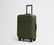 Angled product view of The Softside Bigger Carry-On suitcase in Olive Green with raised handle