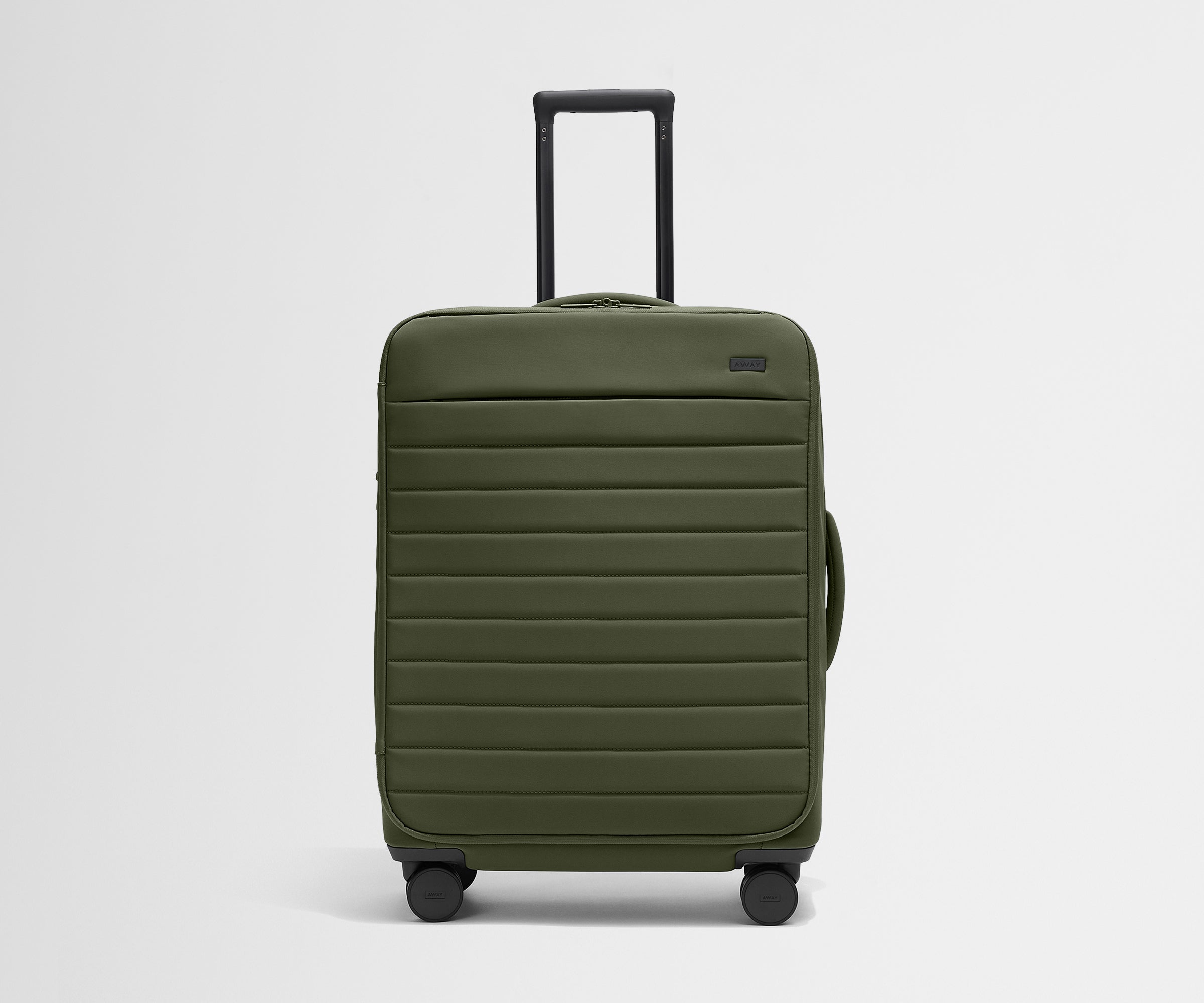 Front product view of The Softside Medium suitcase in Olive Green with raised handle