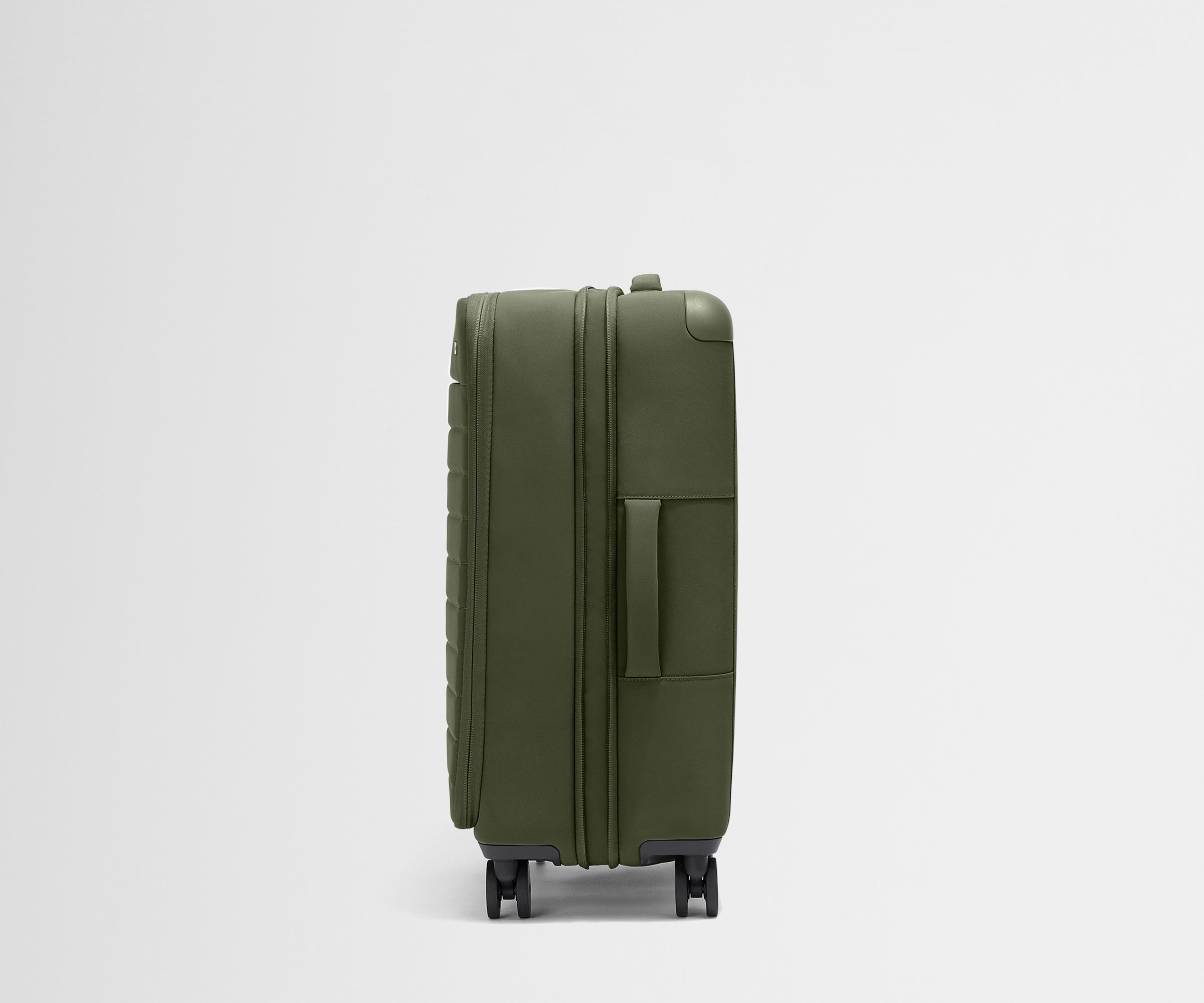 Side product view of The Softside Medium suitcase in Olive Green shown fully expanded