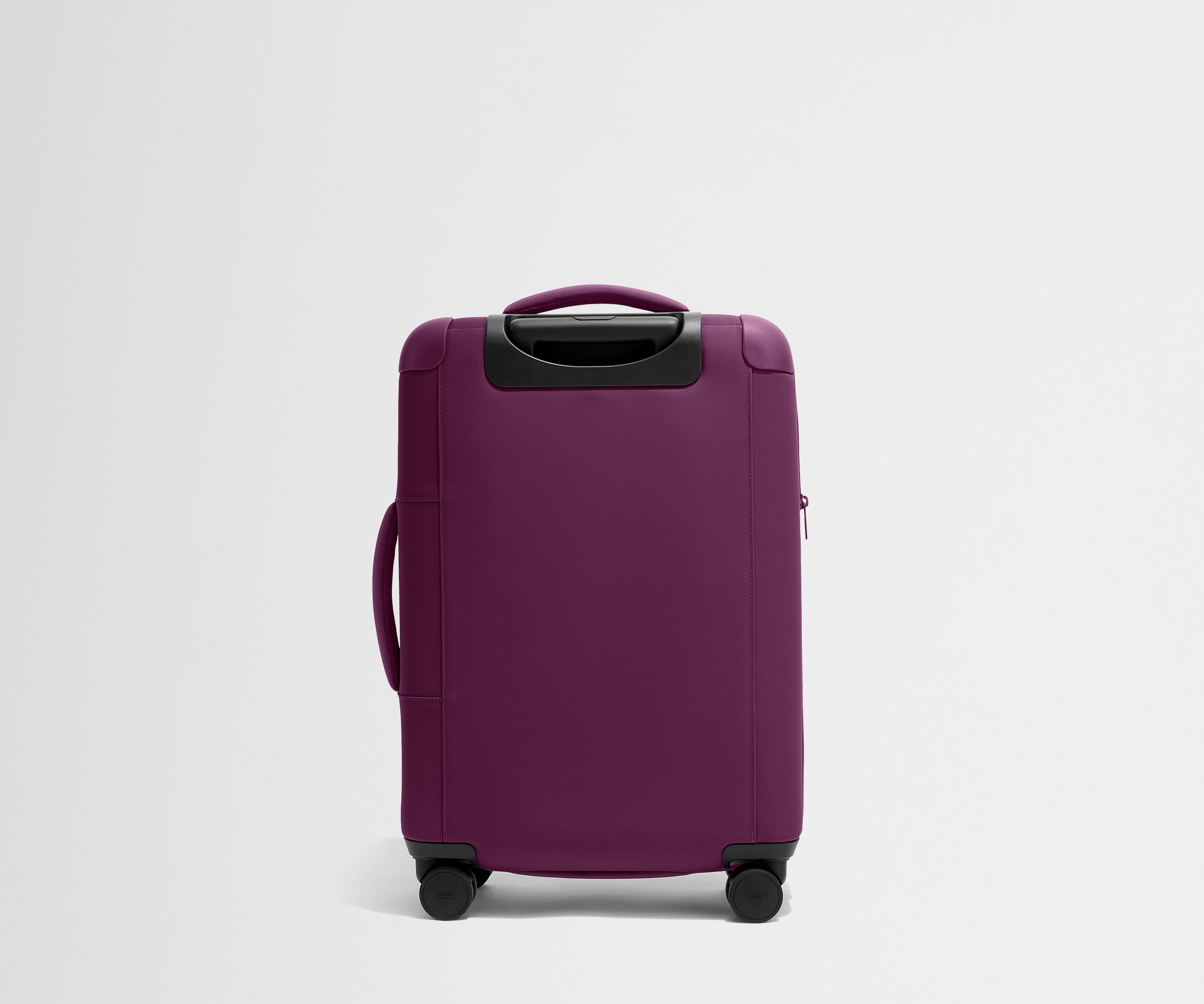 Back product view of The Softside Bigger Carry-On suitcase in Plum Purple