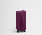 Side product view of The Softside Bigger Carry-On suitcase in Plum Purple shown fully expanded