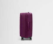 Side product view of The Softside Medium suitcase in Plum Purple shown fully expanded
