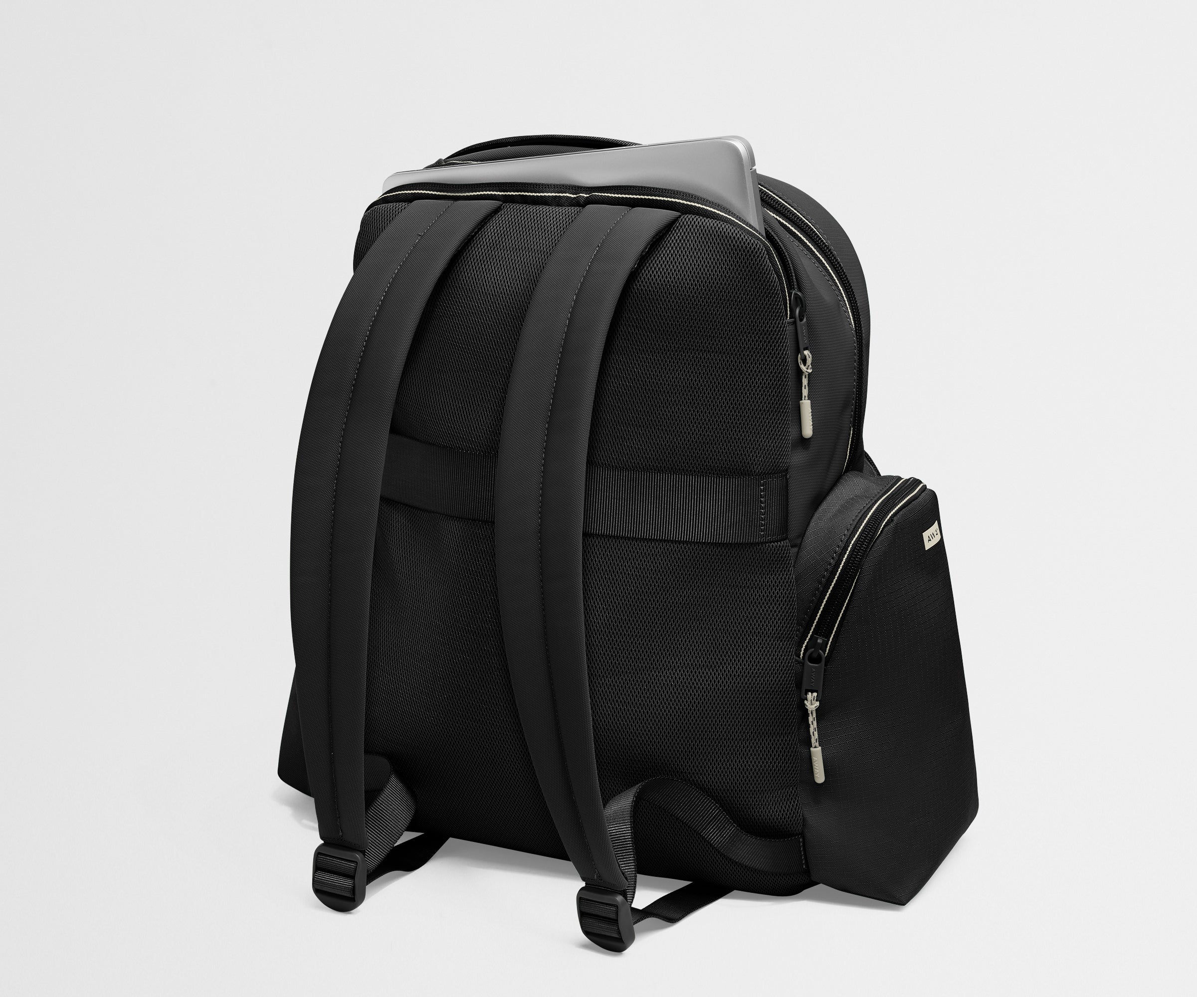 Black backpack on a light gray background