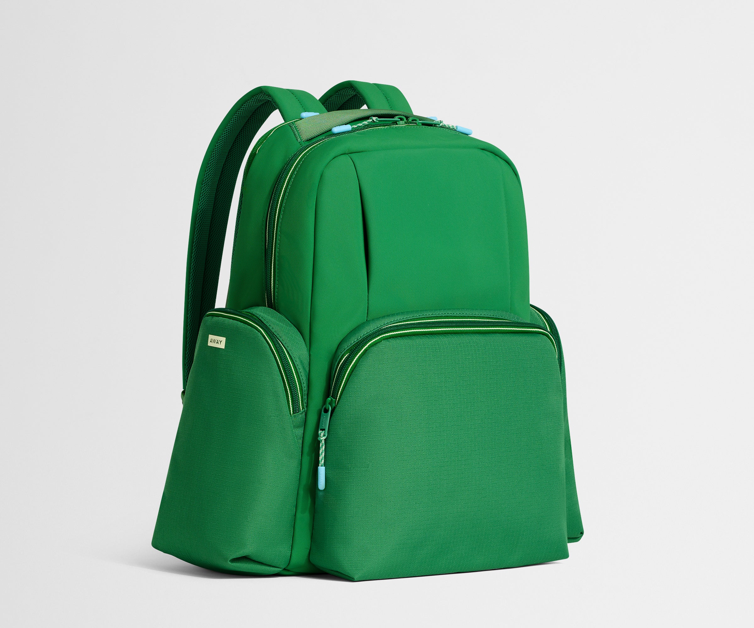 Green backpack on a light gray background