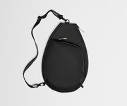 Black sling bag on a light gray background