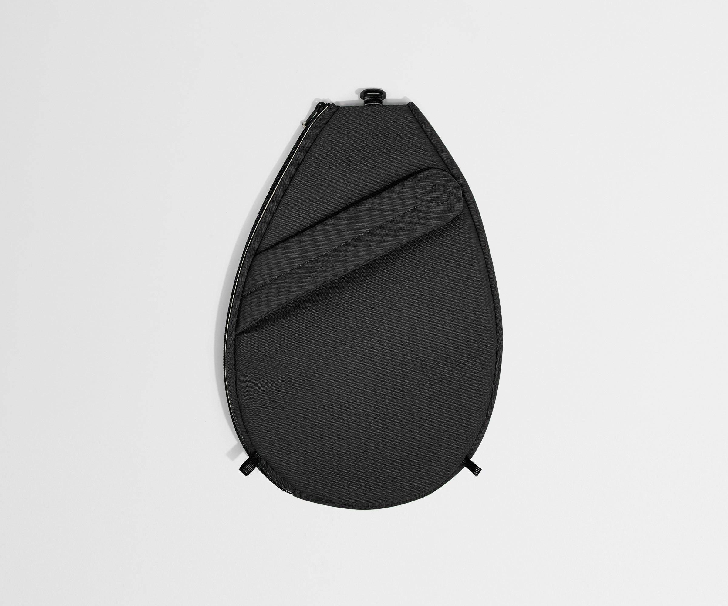 Black round pouch on a light gray background