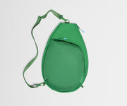 Green crossbody bag on a light gray background