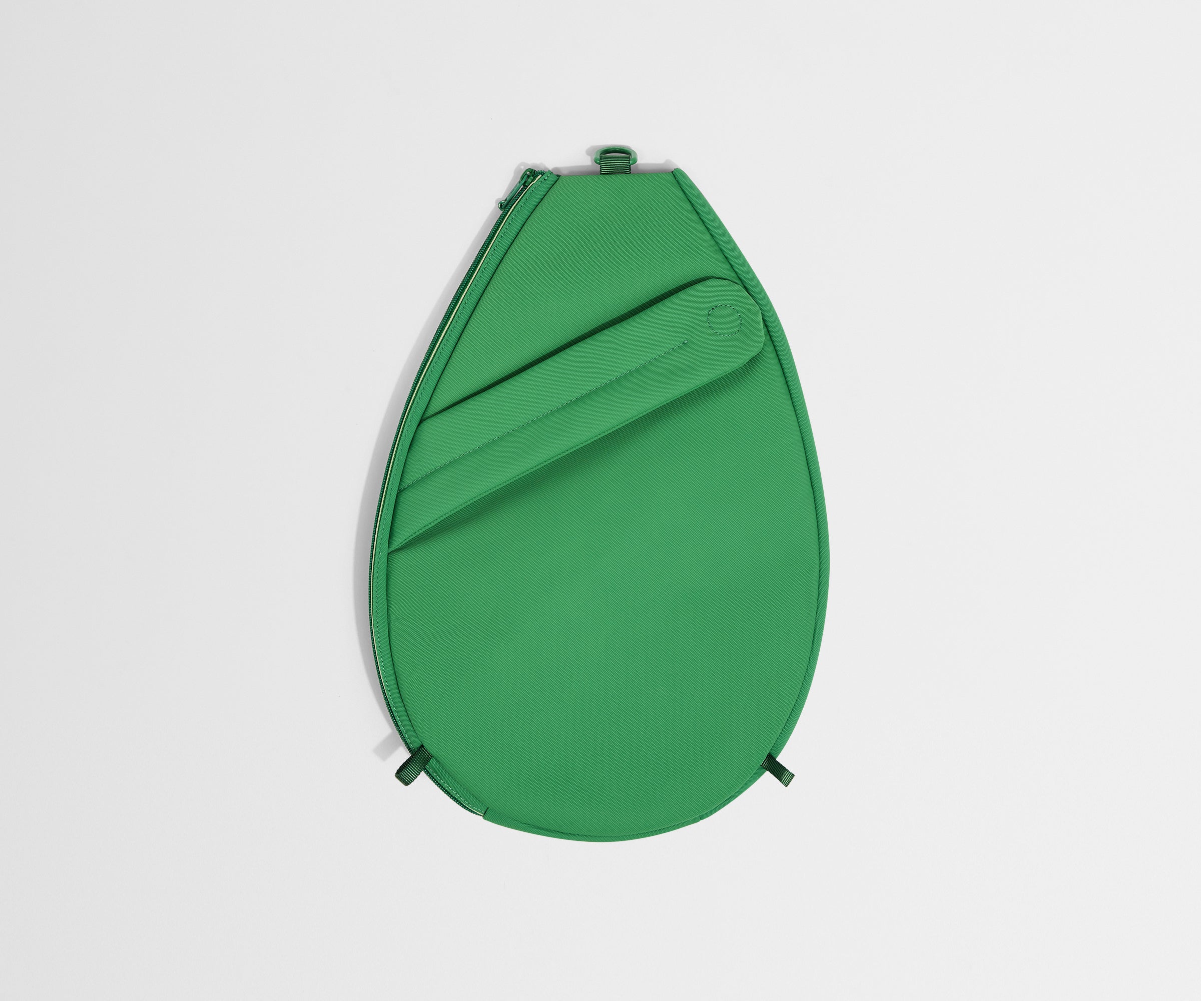 Green round product on a light gray background