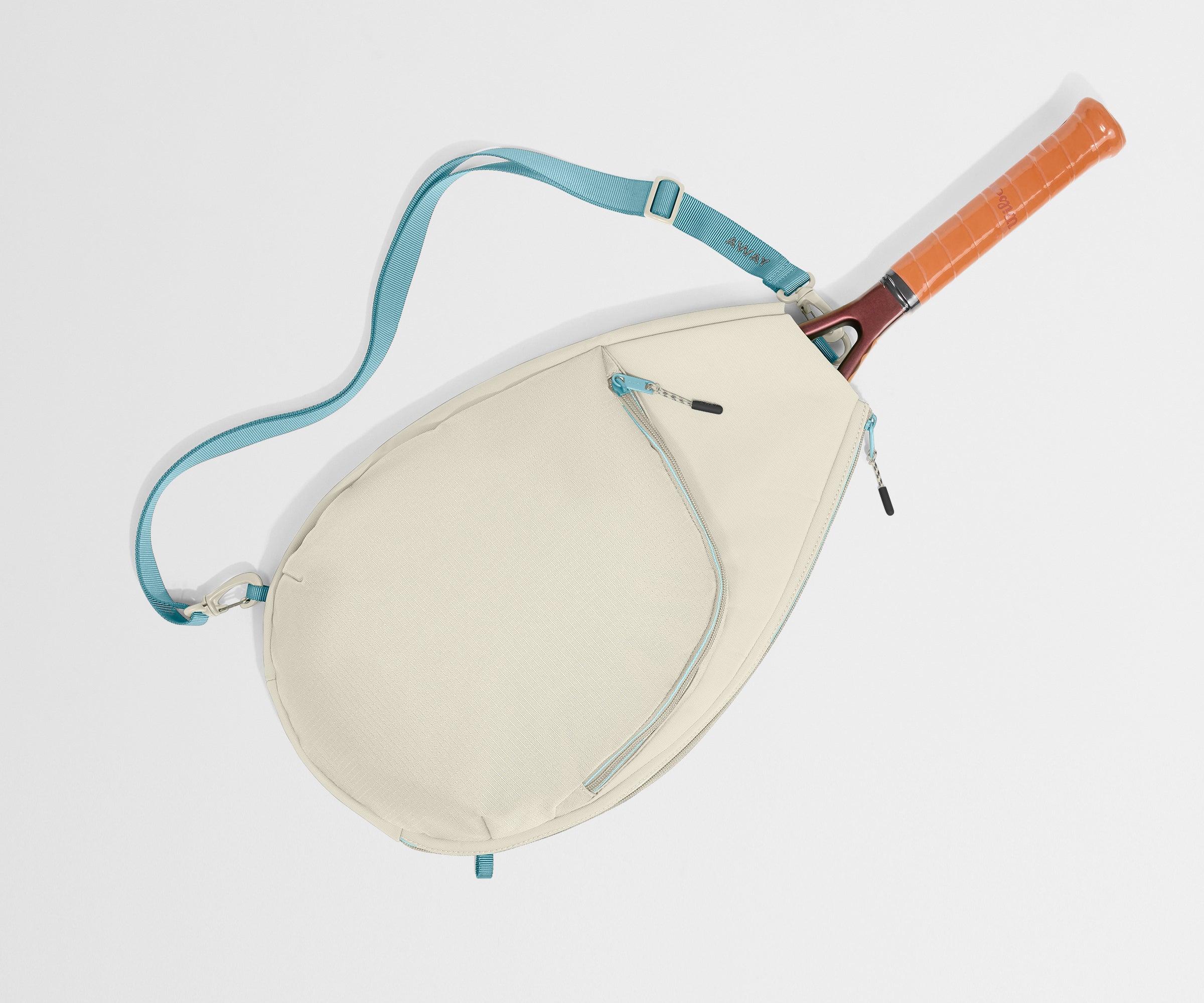 Beige racket bag with blue strap and orange handle on a light gray background