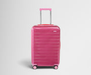 Front product view of The Bigger Carry-On suitcase in Translucent Pink