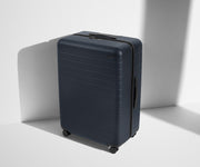 Angled product view of The Large suitcase in Navy Blue