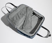 Open, unpacked Weekender Bag showing the mesh compartments and pockets