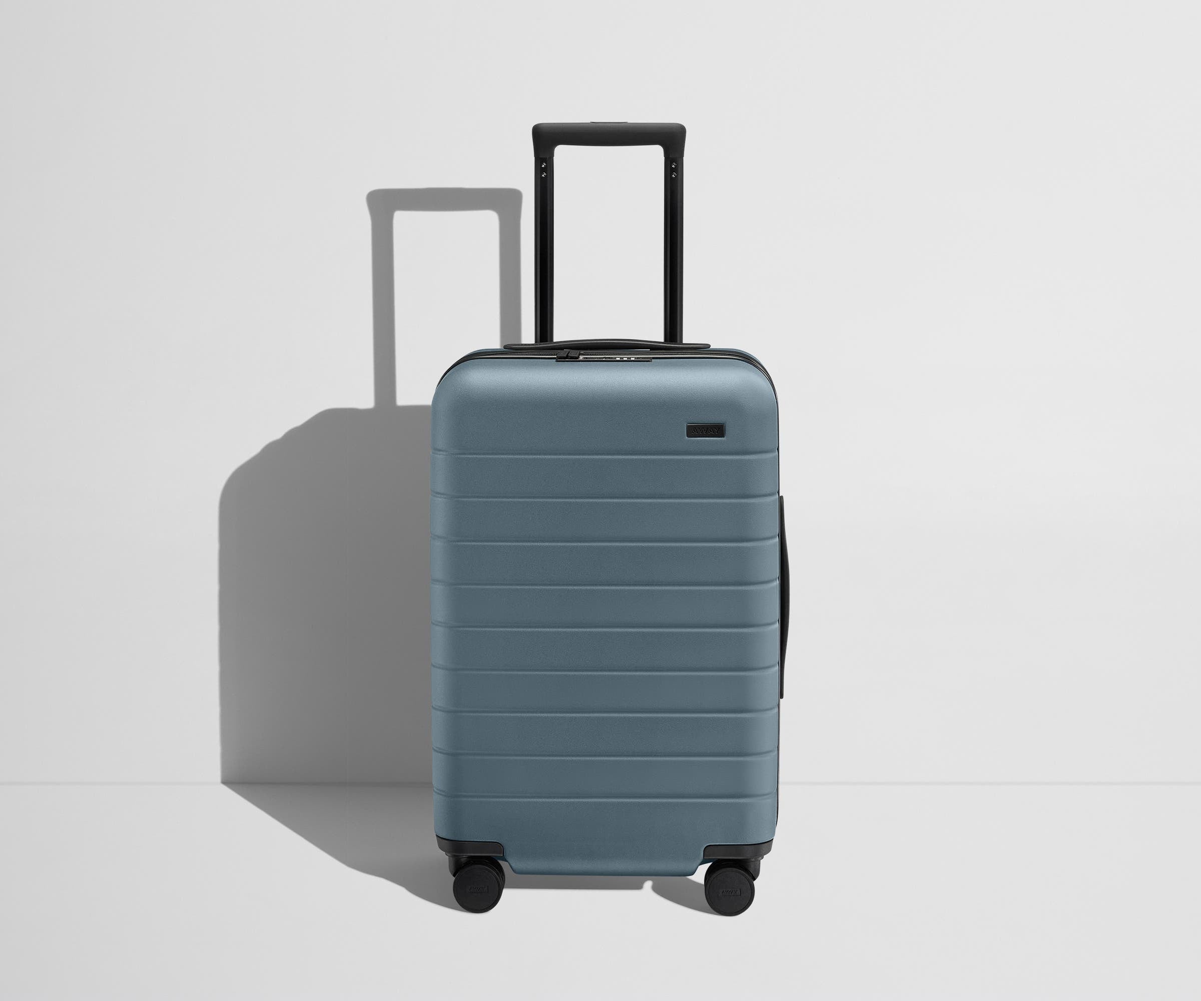 Front product view of The Carry-On Flex suitcase in Coast Blue with raised handle
