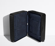 The Large suitcase in Jet Black shown open in an upright position to show interior organization and compression system