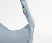 Chapstick in the discreet, zippered strap pocket