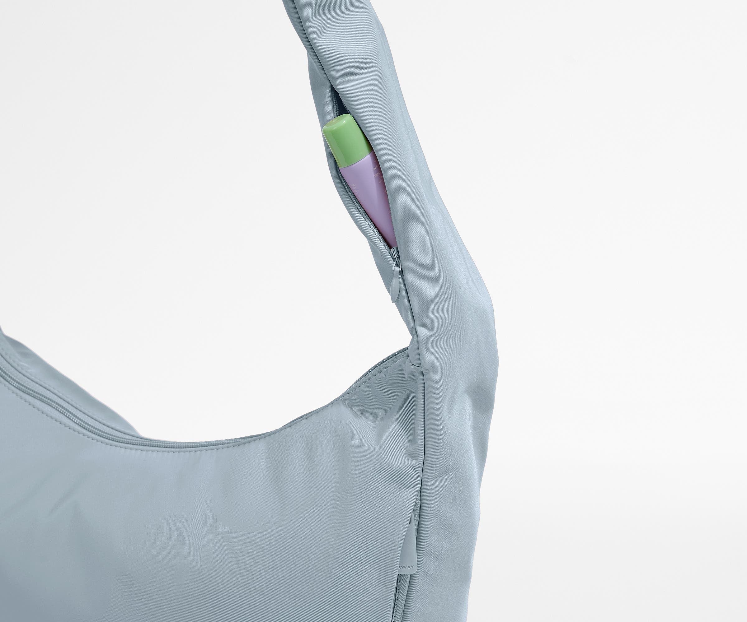 Chapstick in the discreet, zippered strap pocket