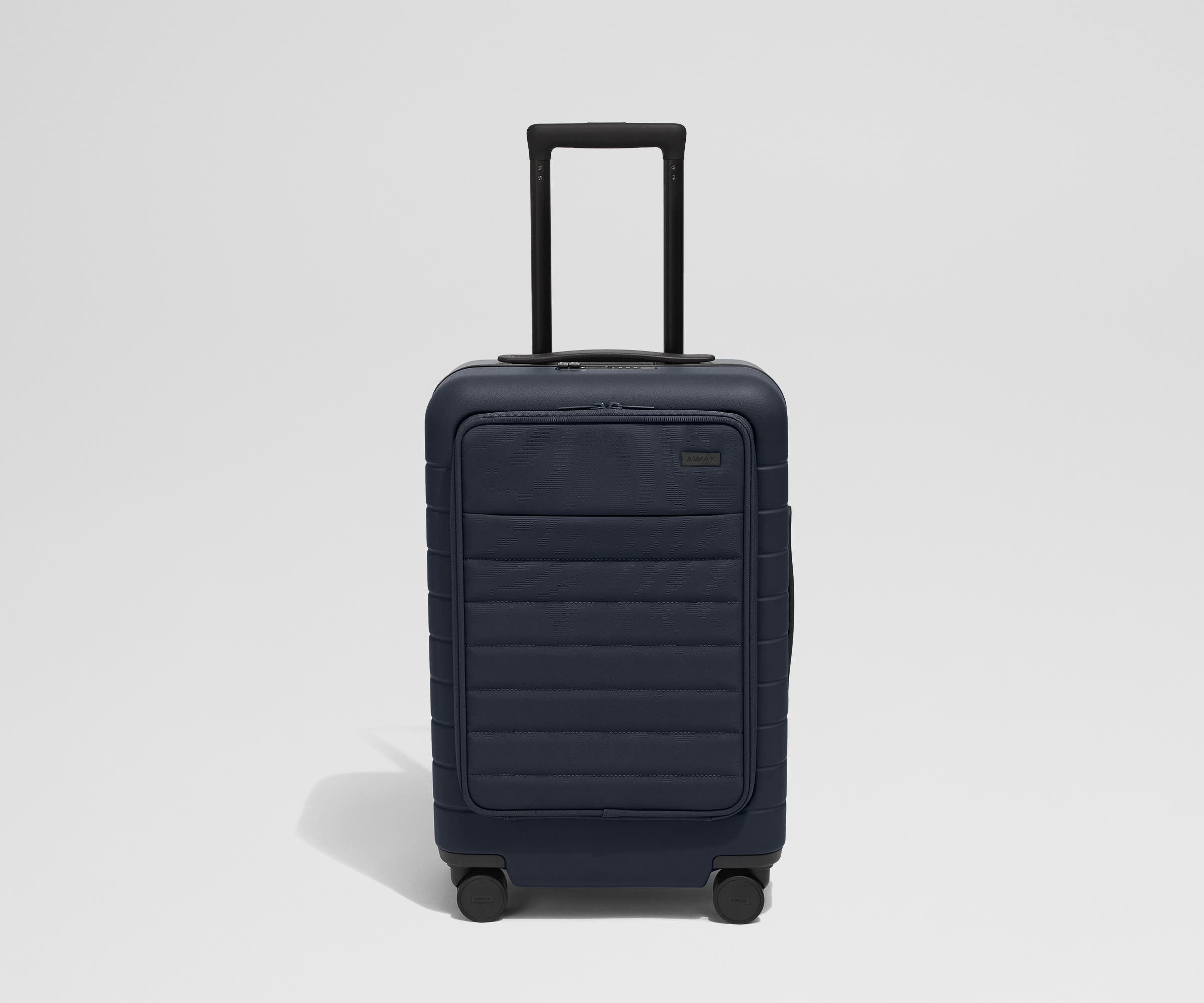 Front product view of The Front Pocket Carry-On suitcase in Navy Blue with raised handle