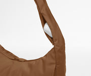 Earpods case packed in the discreet, zippered strap pocket